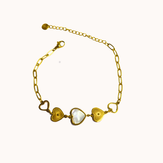 Gold bracelet with heart-shaped links on a white background
