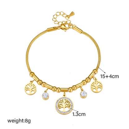 Gold bracelet with charms on a white background