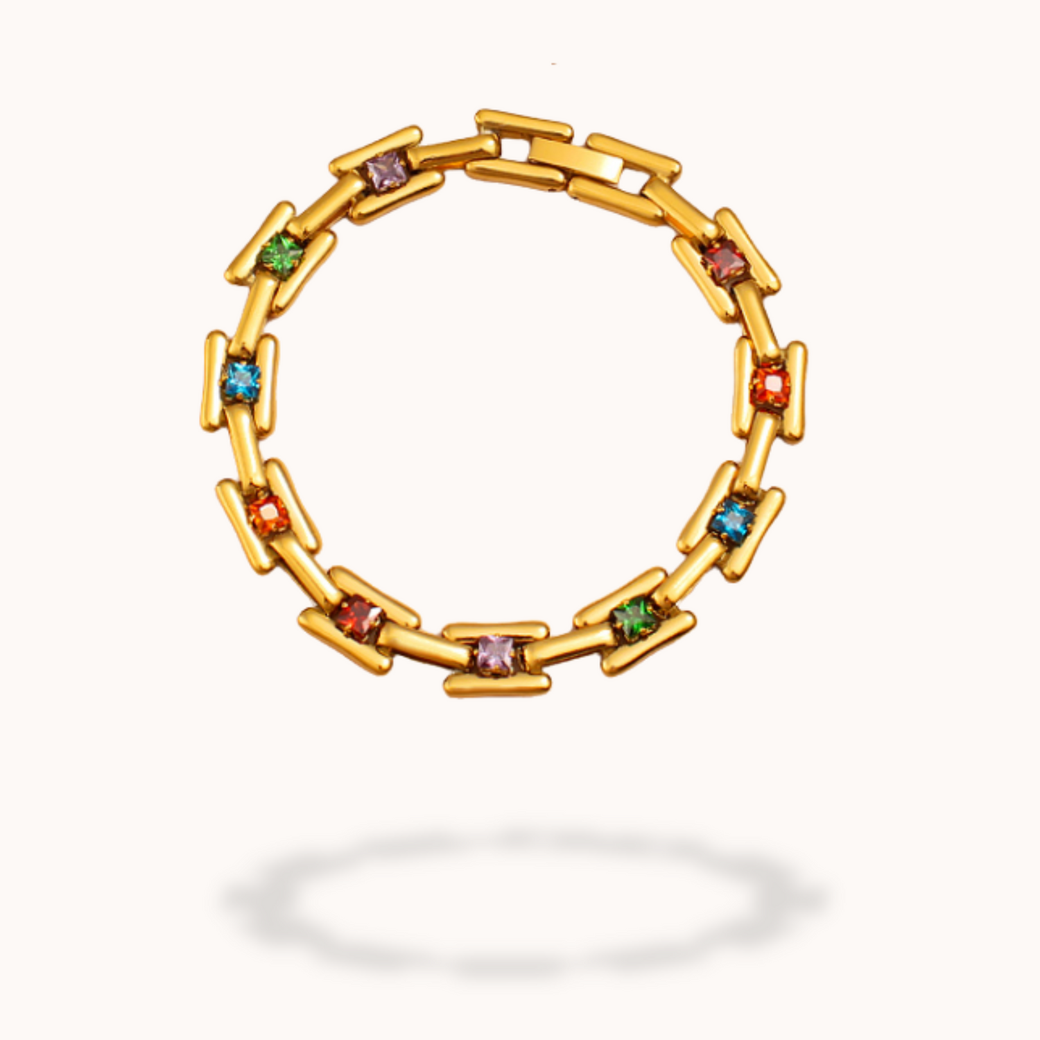 Gold bracelet with colorful gemstones on a white background