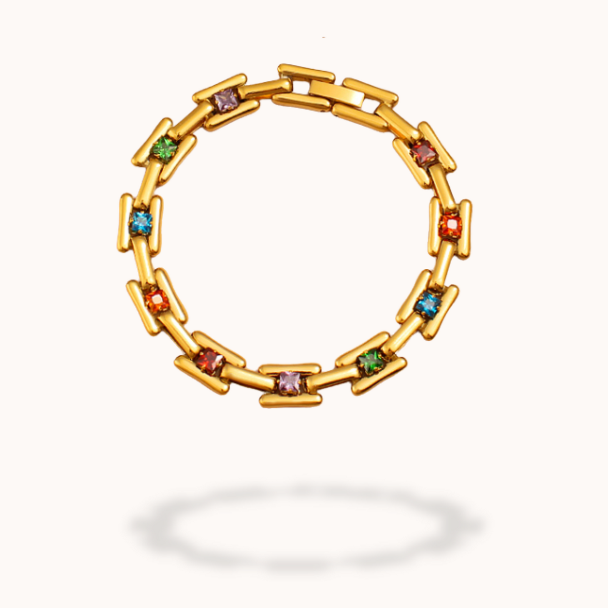 Gold bracelet with colorful gemstones on a white background