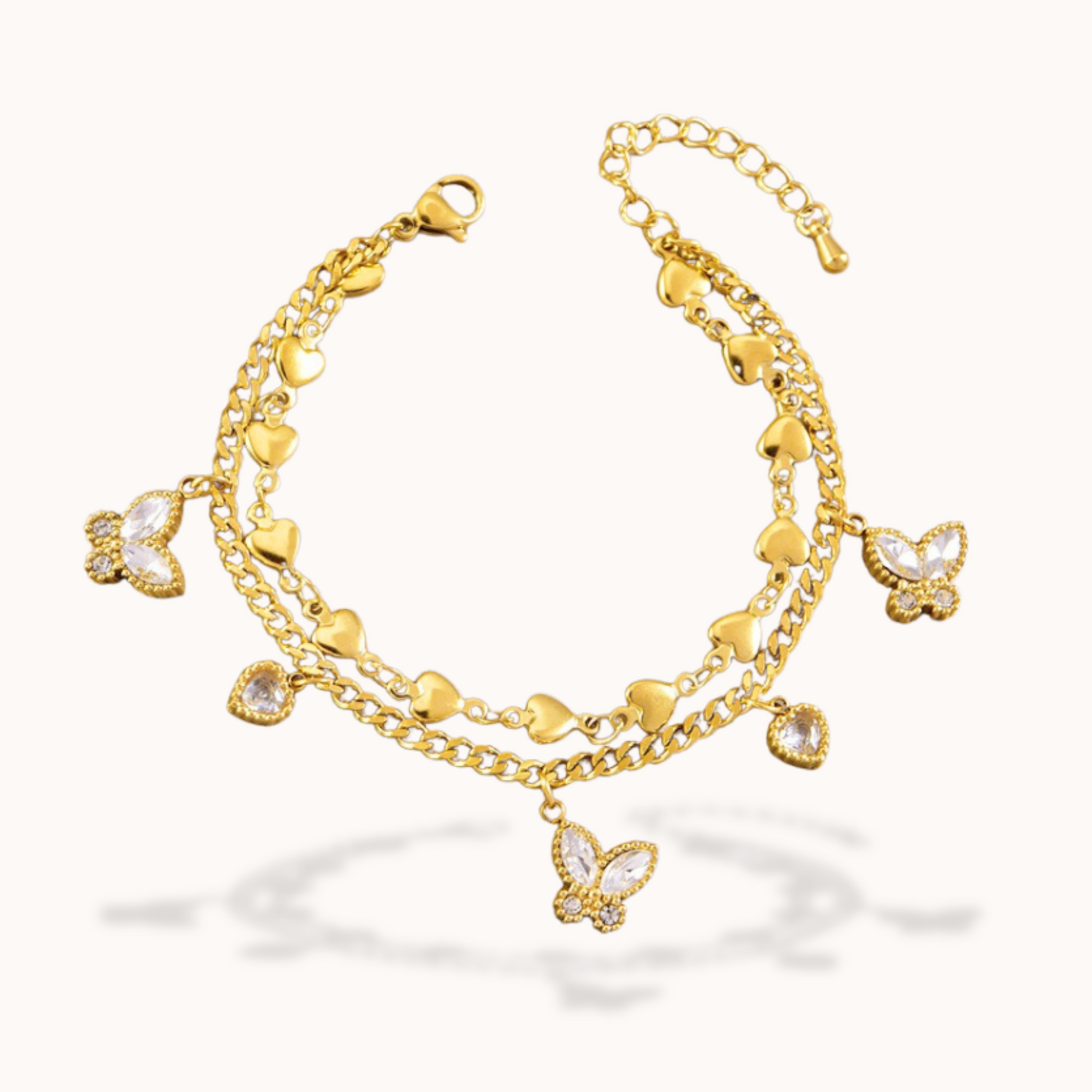 Gold bracelet with butterfly charms on a white background