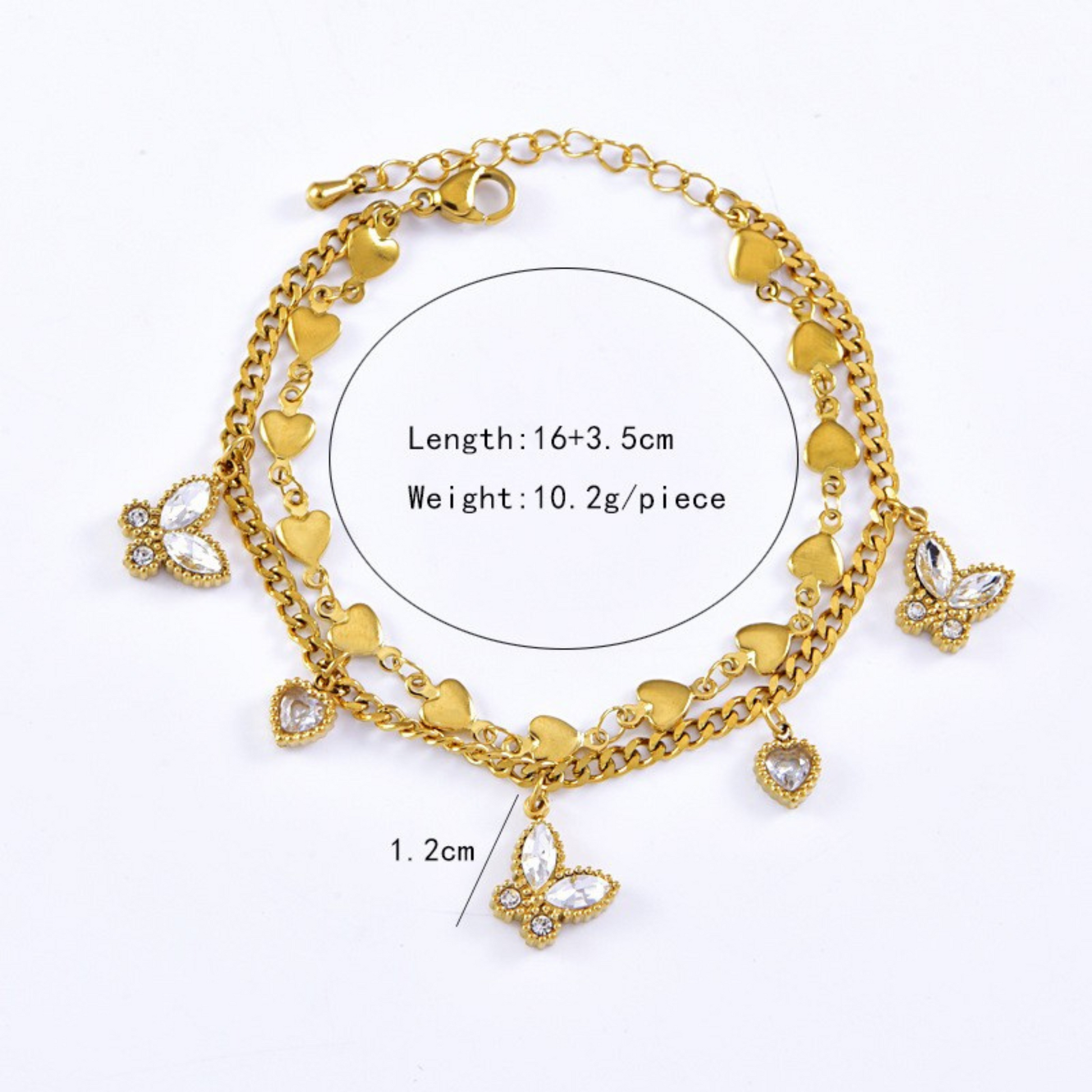 Gold bracelet with heart and butterfly charms on a white background