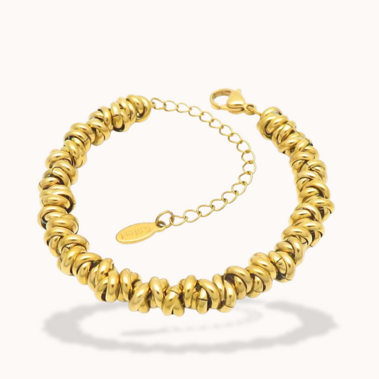 Gold bracelet on a white background