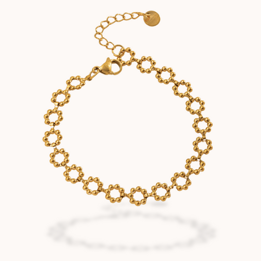 Gold bracelet on a white background