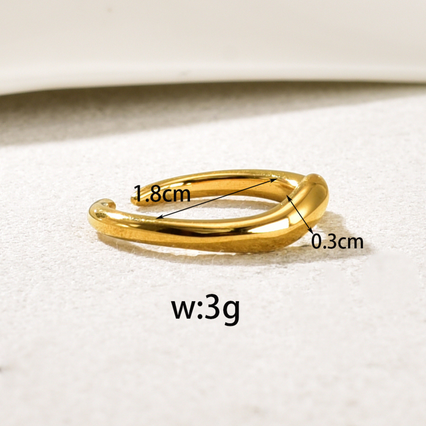 simple gold ring in white background with measurement
