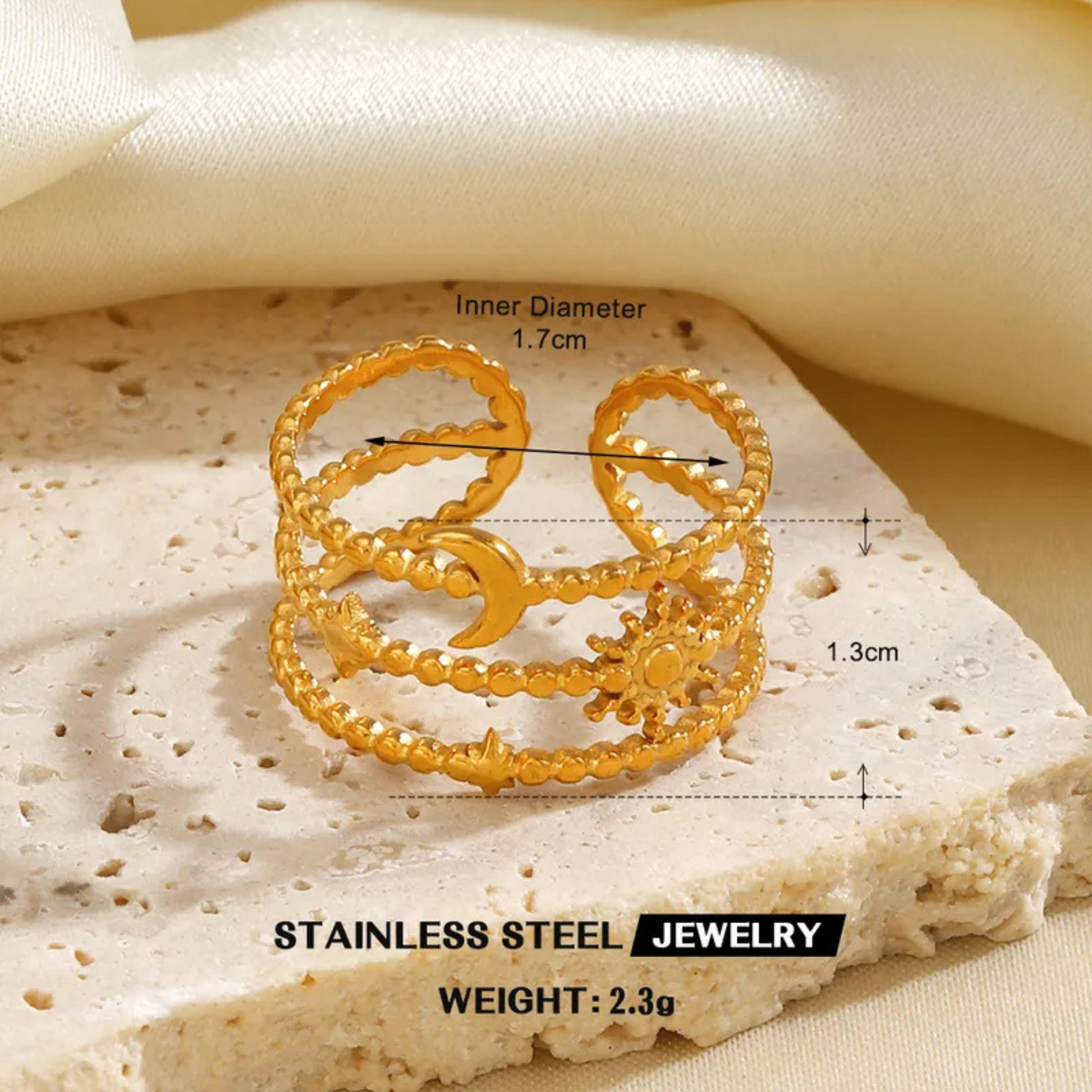 Gold ring with measurements on a textured beige surface