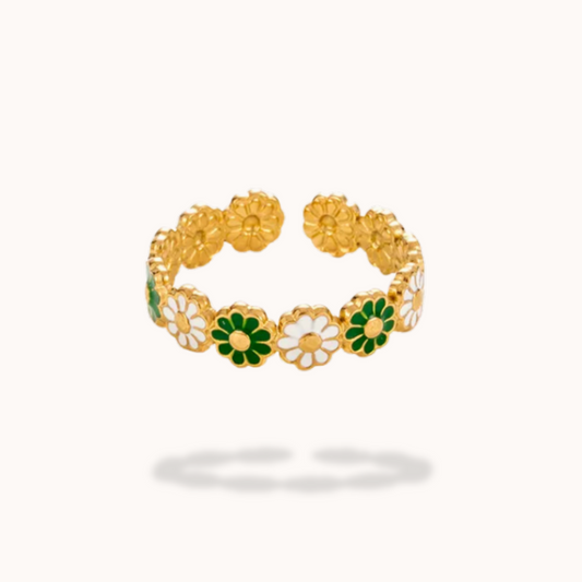 Gold ring with floral designs on a white background