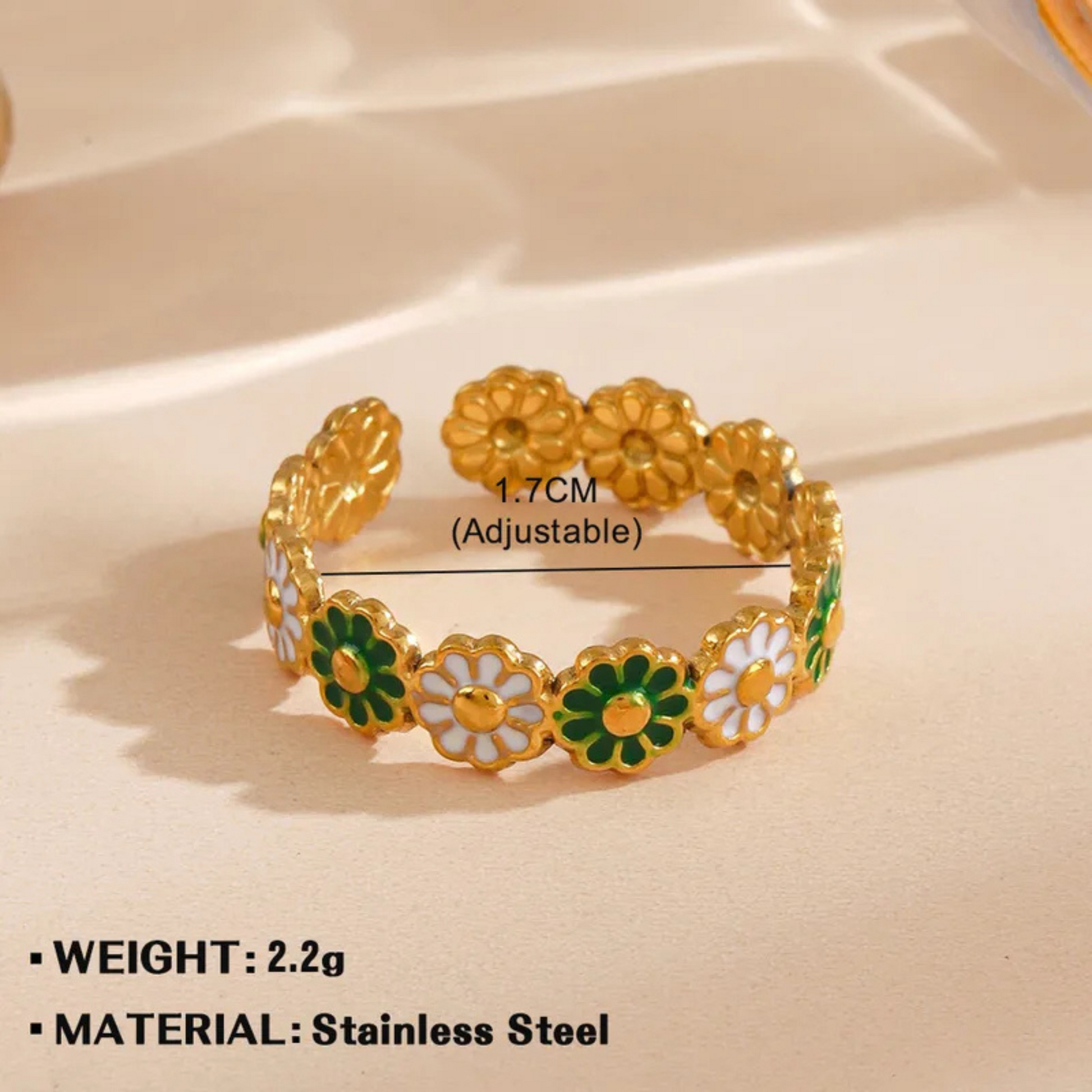 Gold bracelet with floral design on a beige background