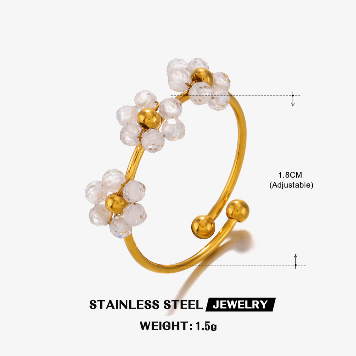 Gold ring with pearl-like beads on a white background