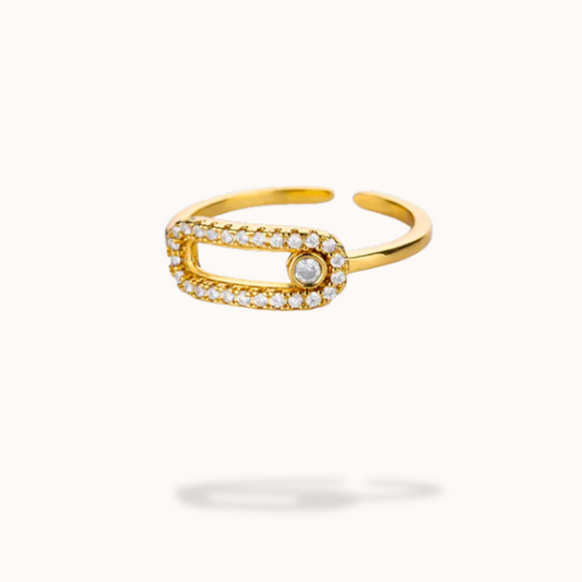 Gold open ring with small diamonds on a white background