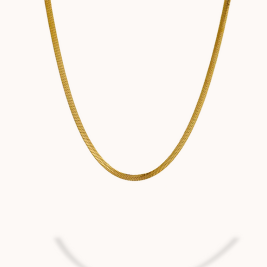 Gold chain necklace on a white background