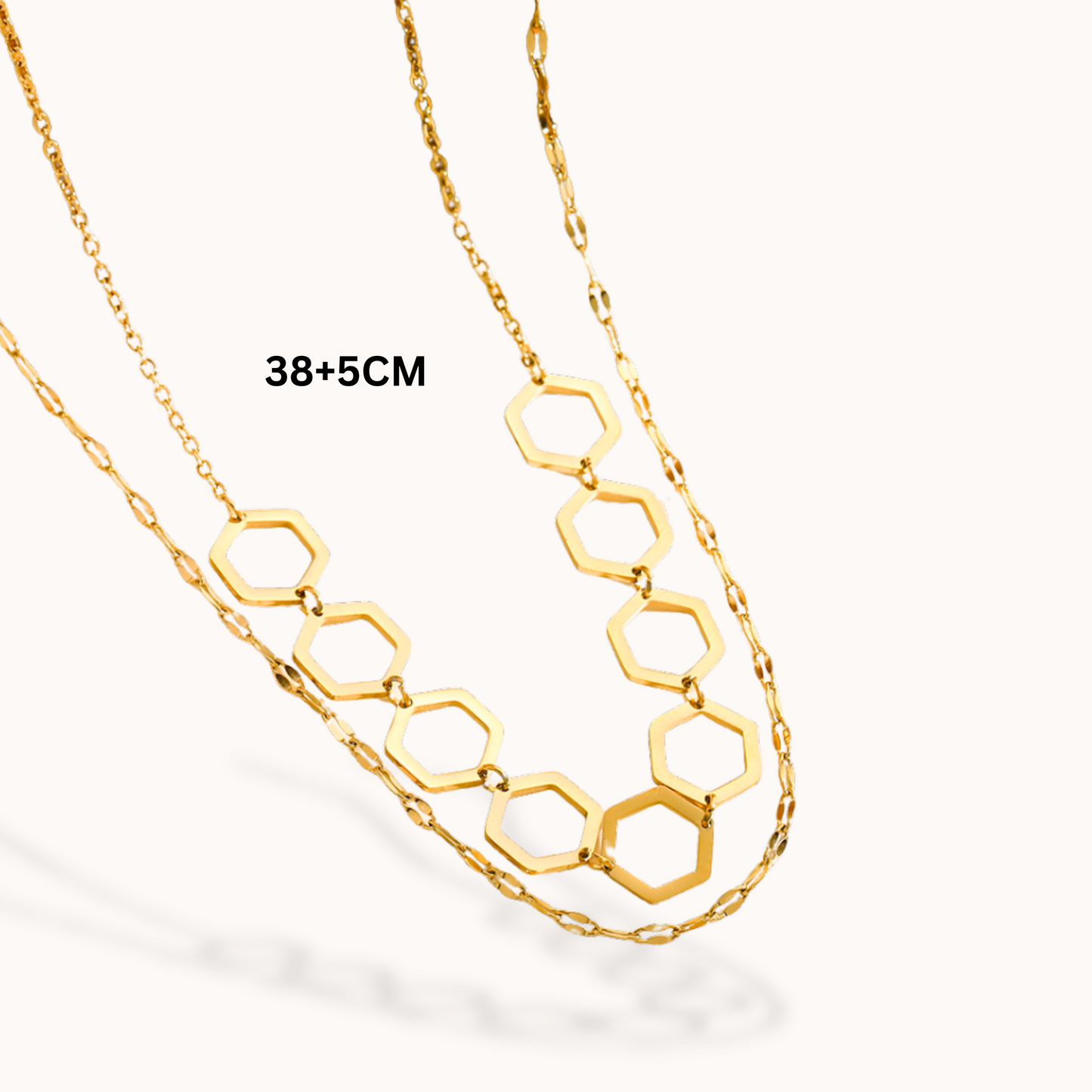 Gold hexagonal chain necklace on a white background
