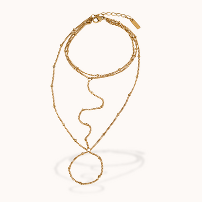 Gold ring bracelet on a white background
