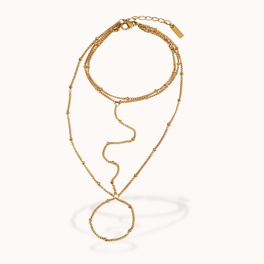Gold ring bracelet on a white background