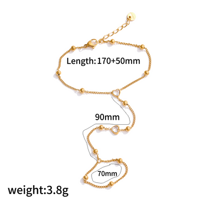 Gold ring bracelet with measurements on a white background