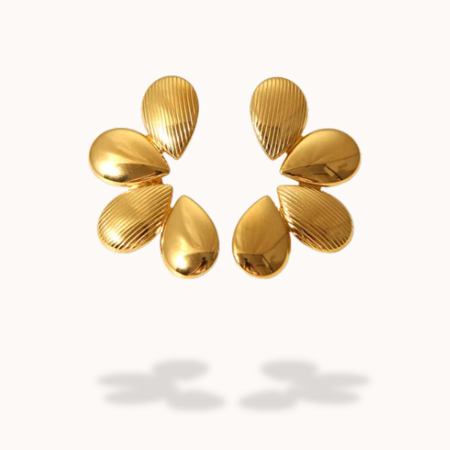 Pair of gold earrings on a white background