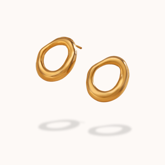 Gold stud earrings on a white background