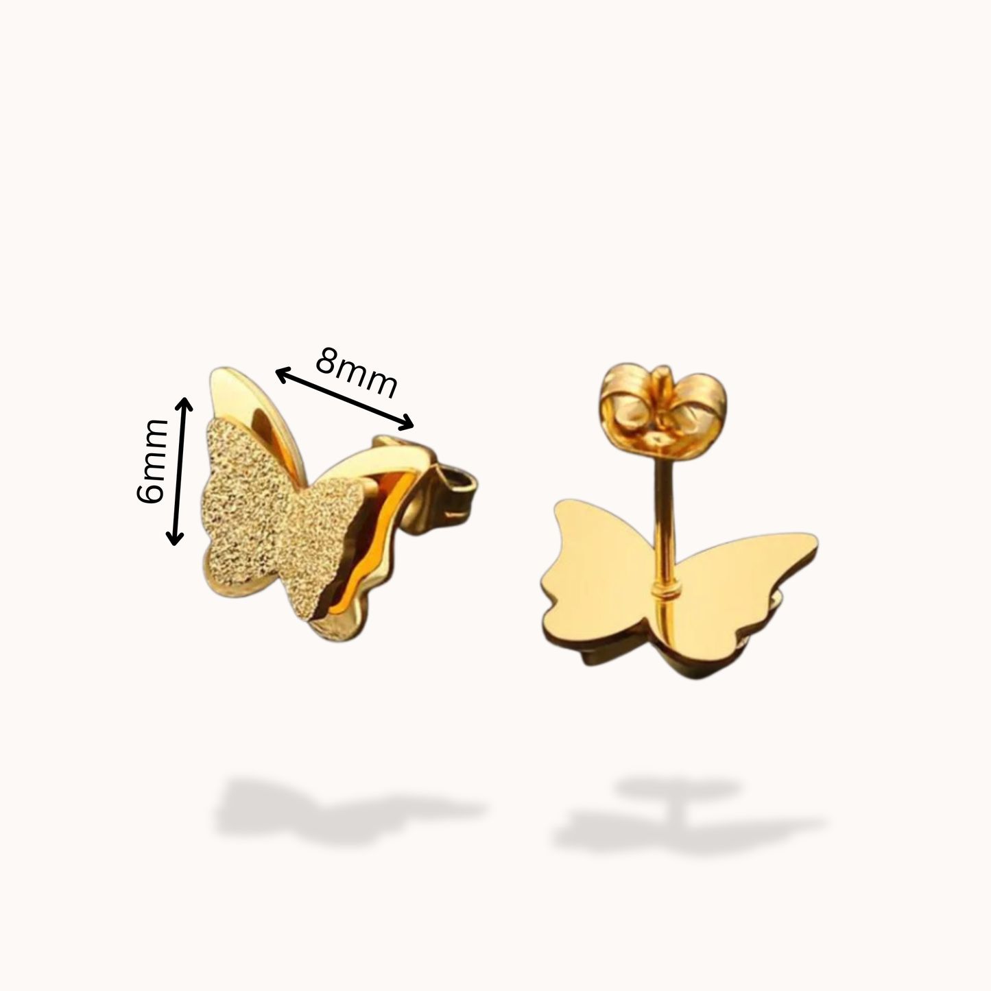Gold butterfly earrings with size measurements on a white background