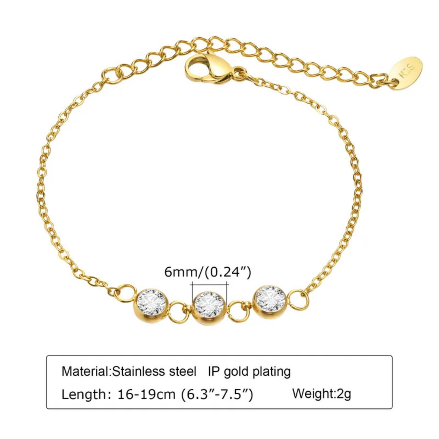 Gold bracelet with three clear stones on a white background