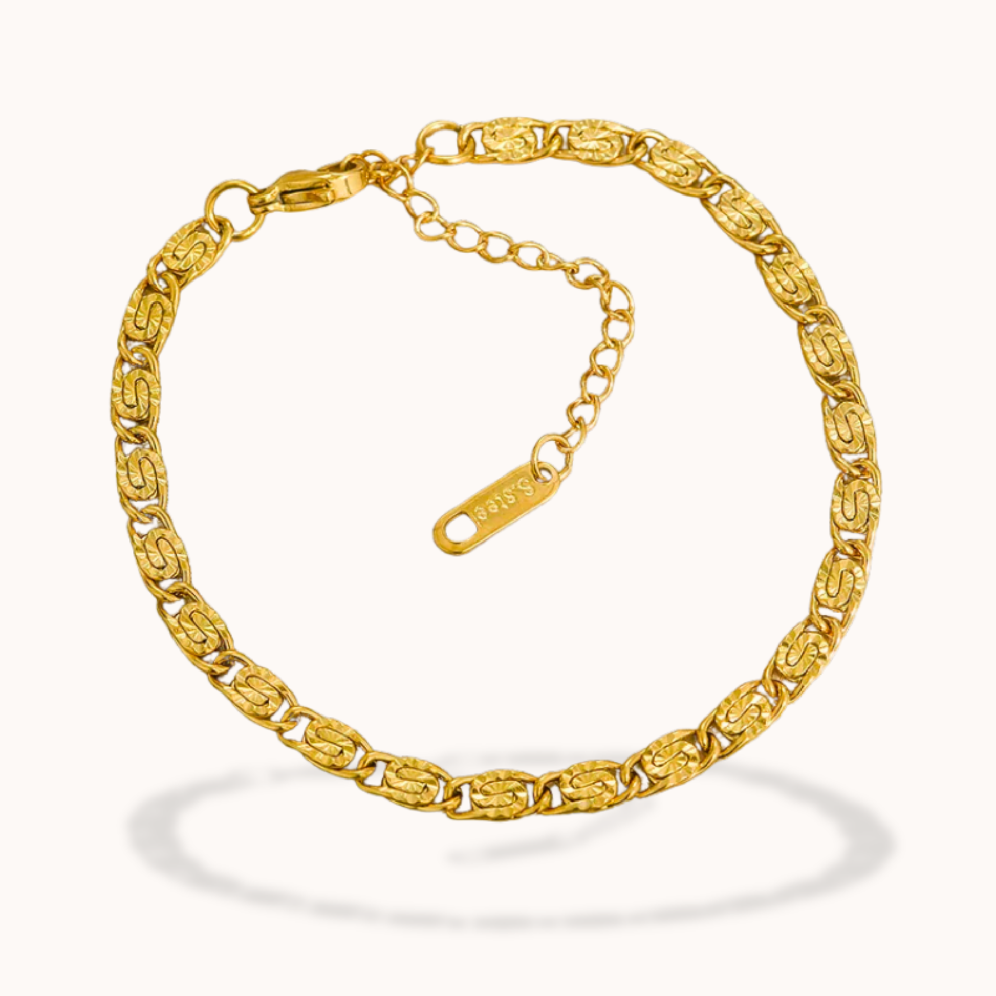 Gold bracelet on a white background