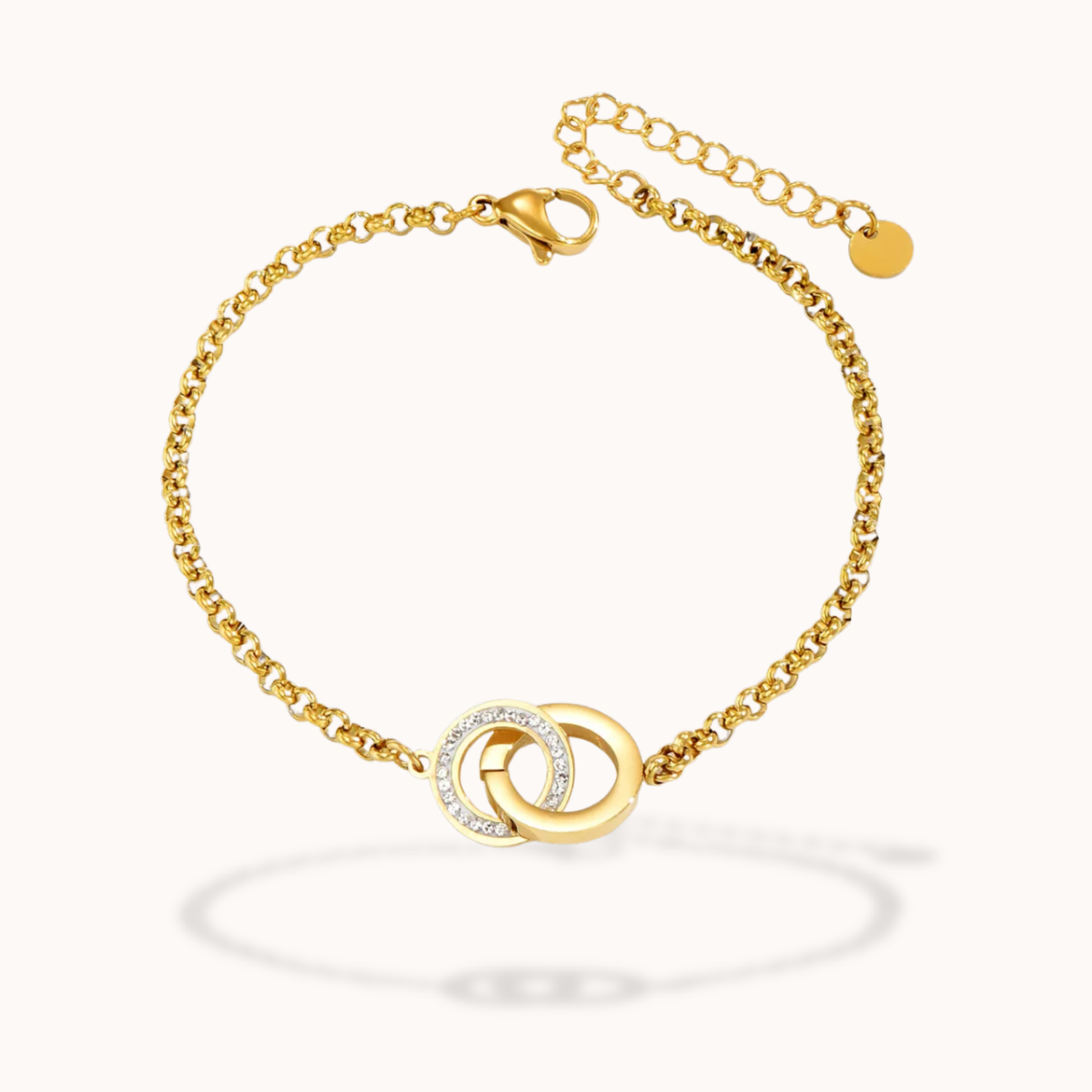 Gold bracelet with a circular design on a white background