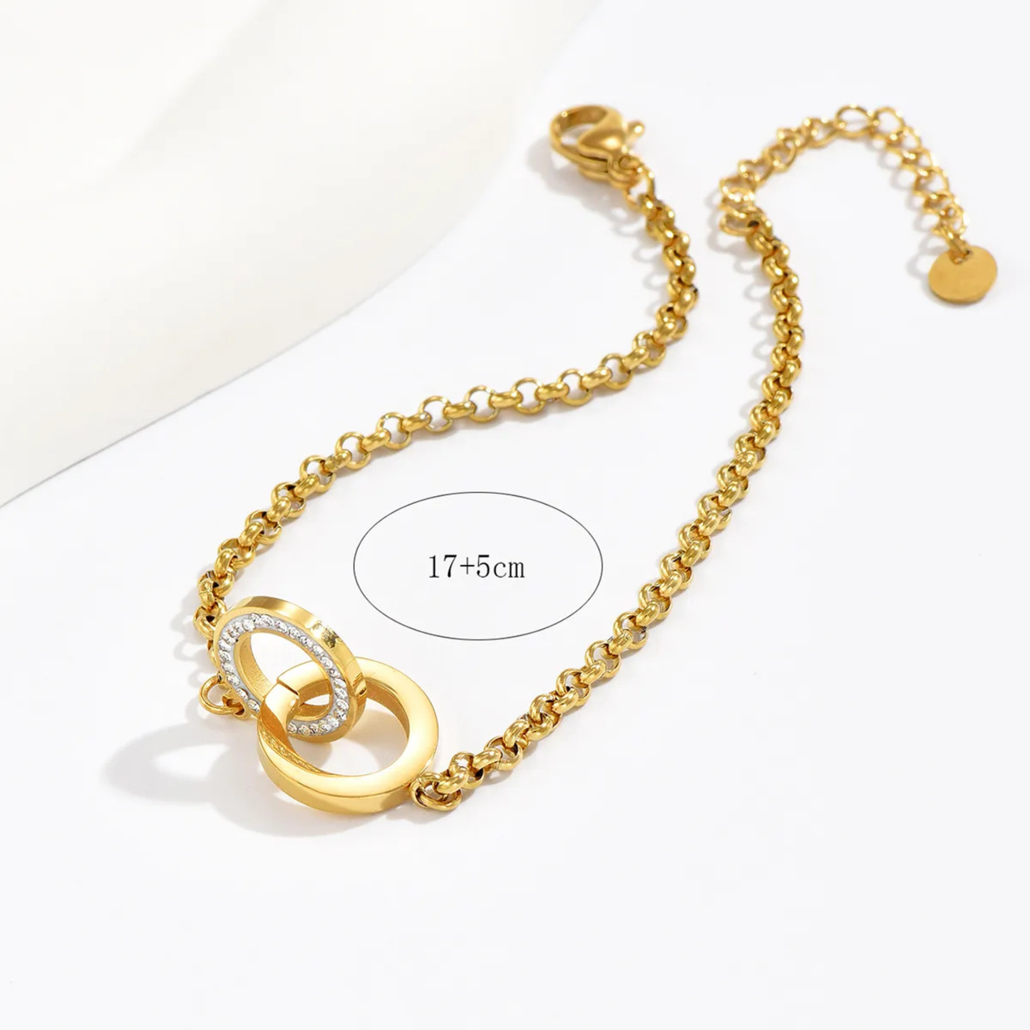 Gold bracelet with a clasp on a white background