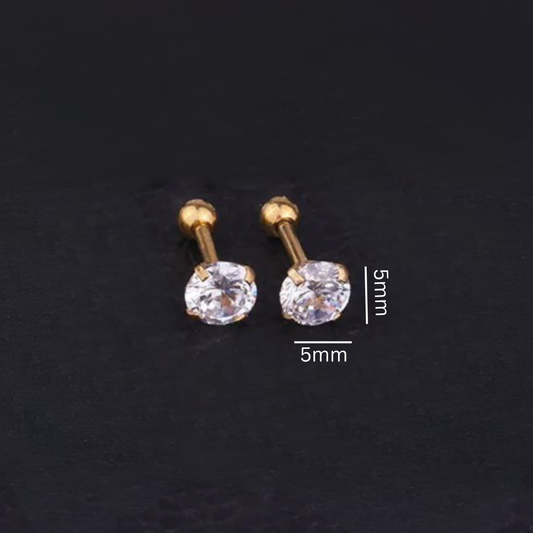 Gold stud earrings with clear gemstones on a dark background, showing measurements.