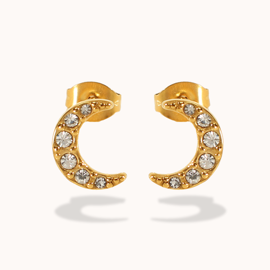 Gold stud earrings with embedded crystals on a white background