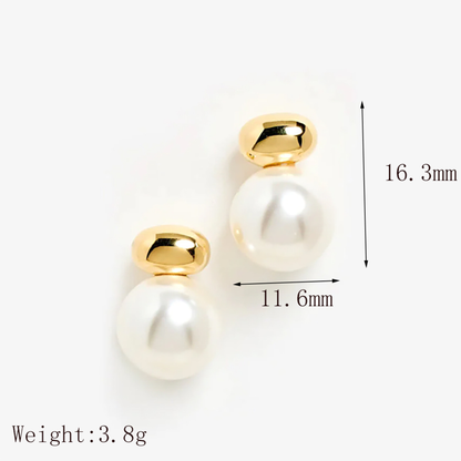 Gold and pearl earrings with measurements on a white background