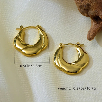 Gold hoop earrings on a light background with measurements and weight displayed.