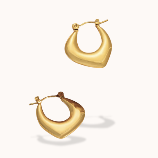 Gold hoop earrings on a white background