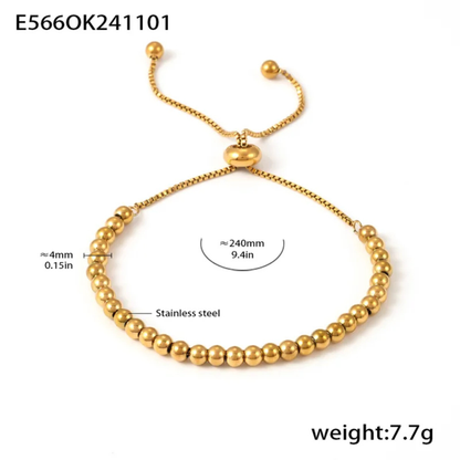 Gold beaded bracelet with measurements and weight on a white background