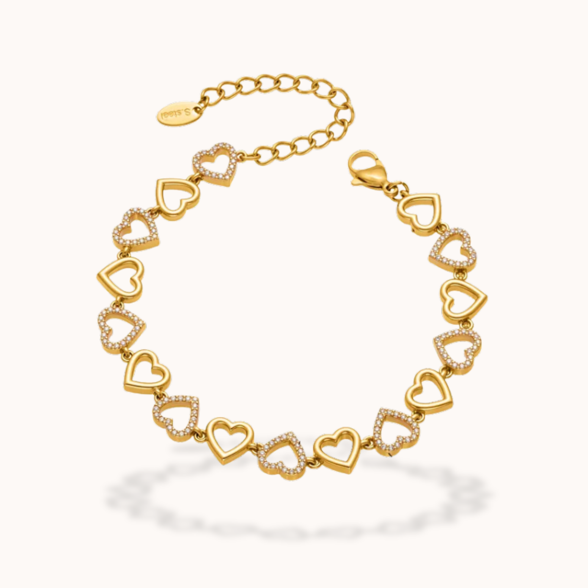 Gold bracelet with heart-shaped links on a white background