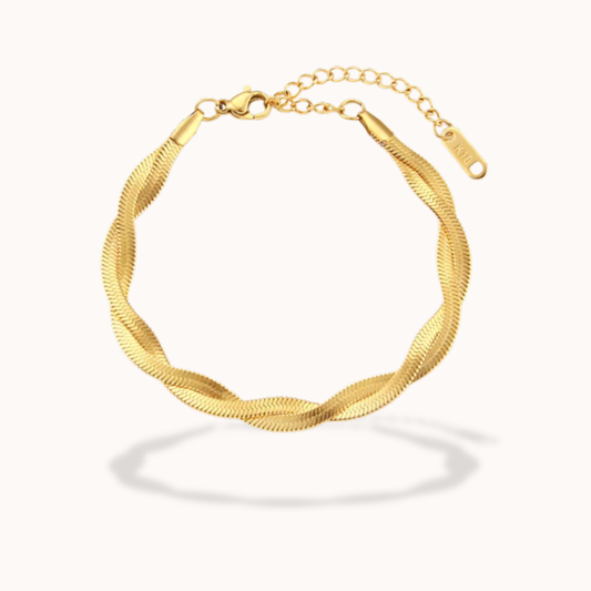 Gold bracelet on a white background