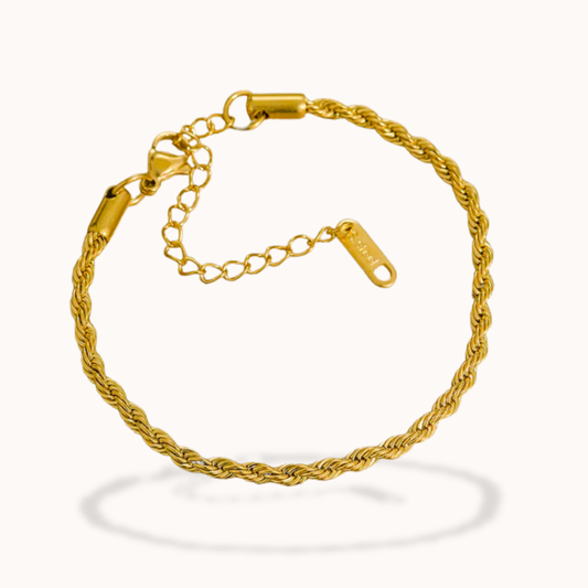 Gold bracelet on a white background