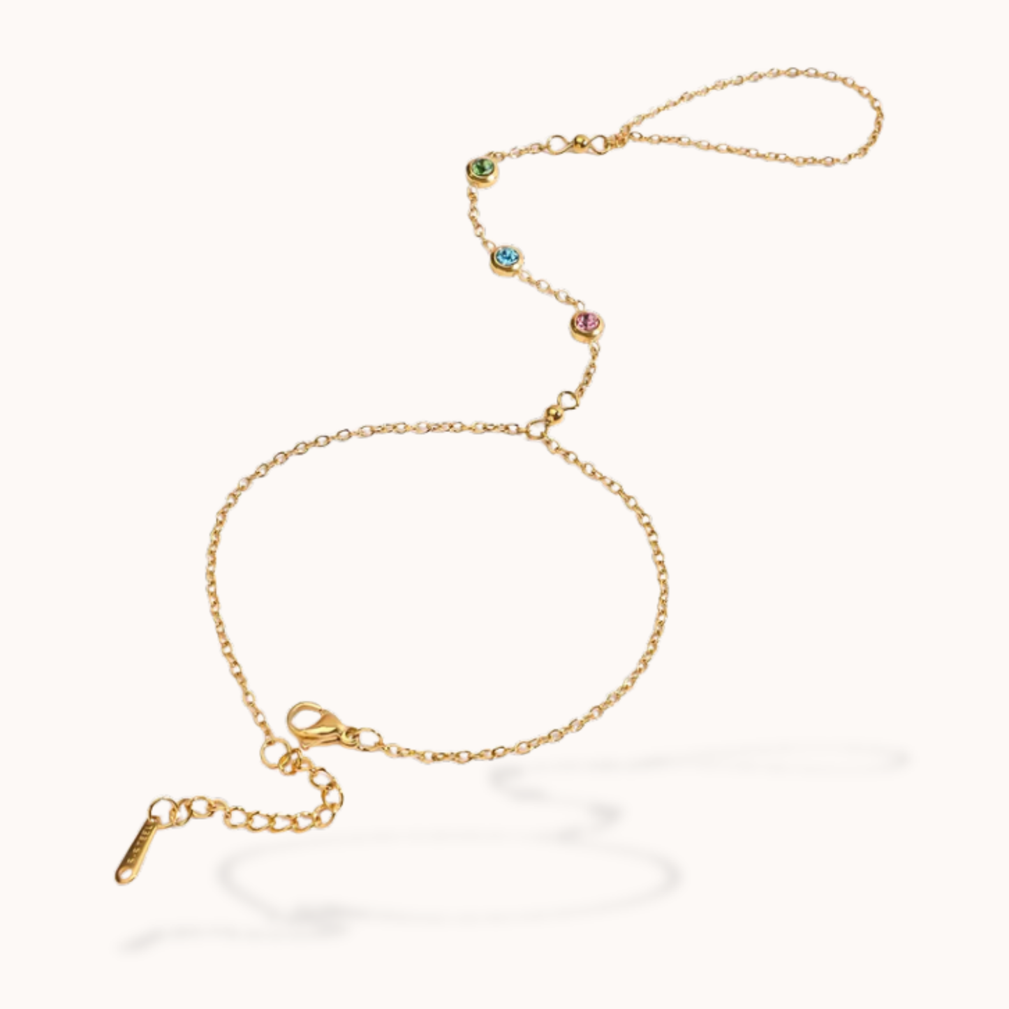 Gold bracelet with colorful beads on a white background