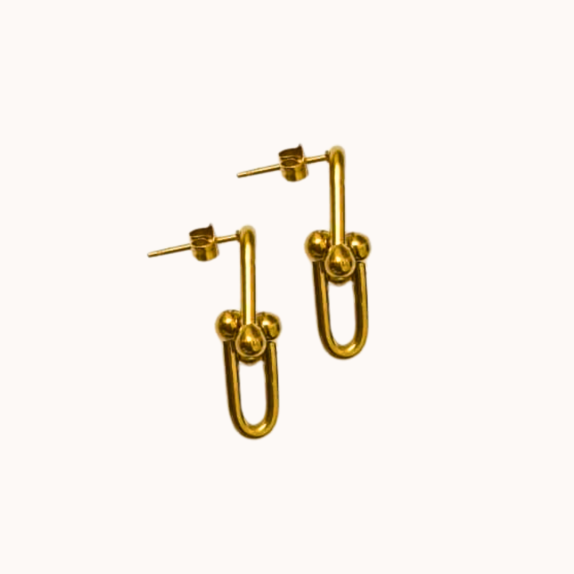 Gold hoop earrings on a white background