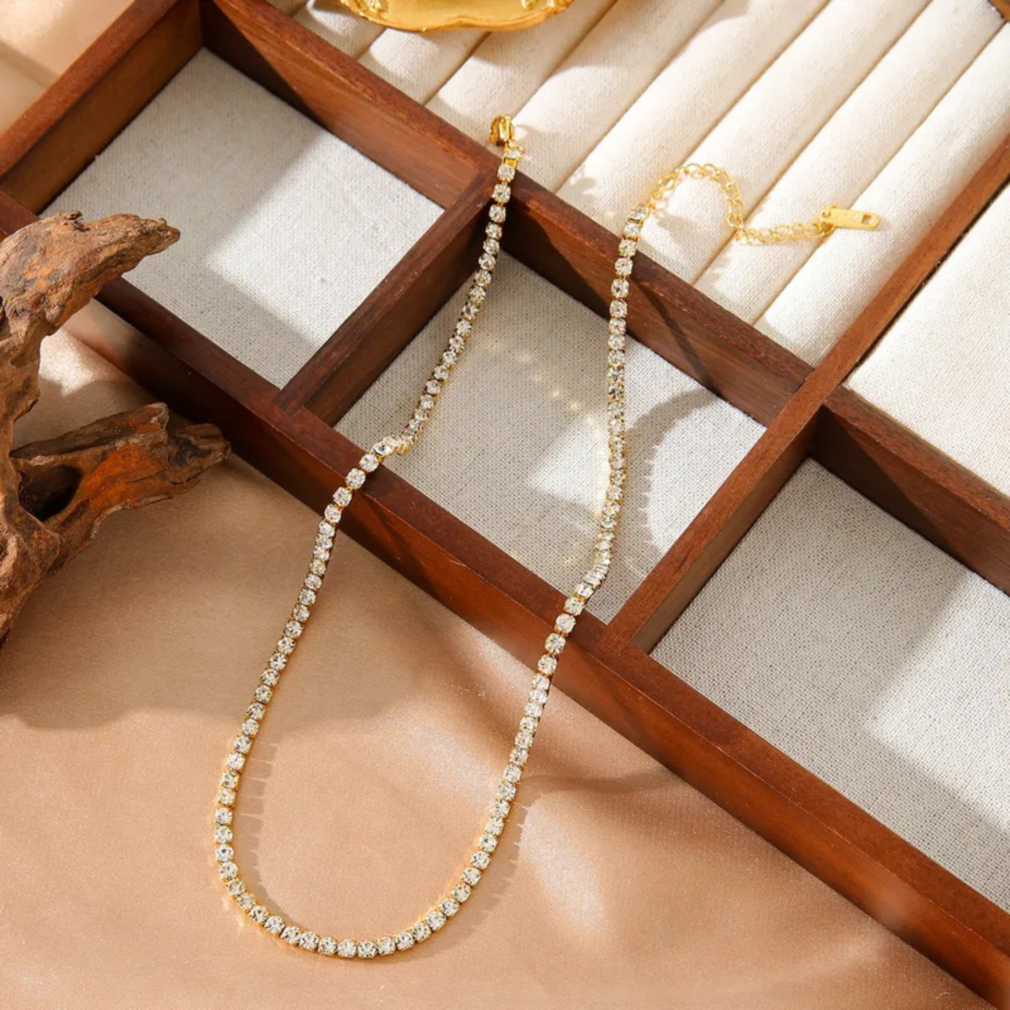 Zircon necklace on a wooden jewelry box with natural light