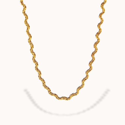 Gold chain necklace on a white background