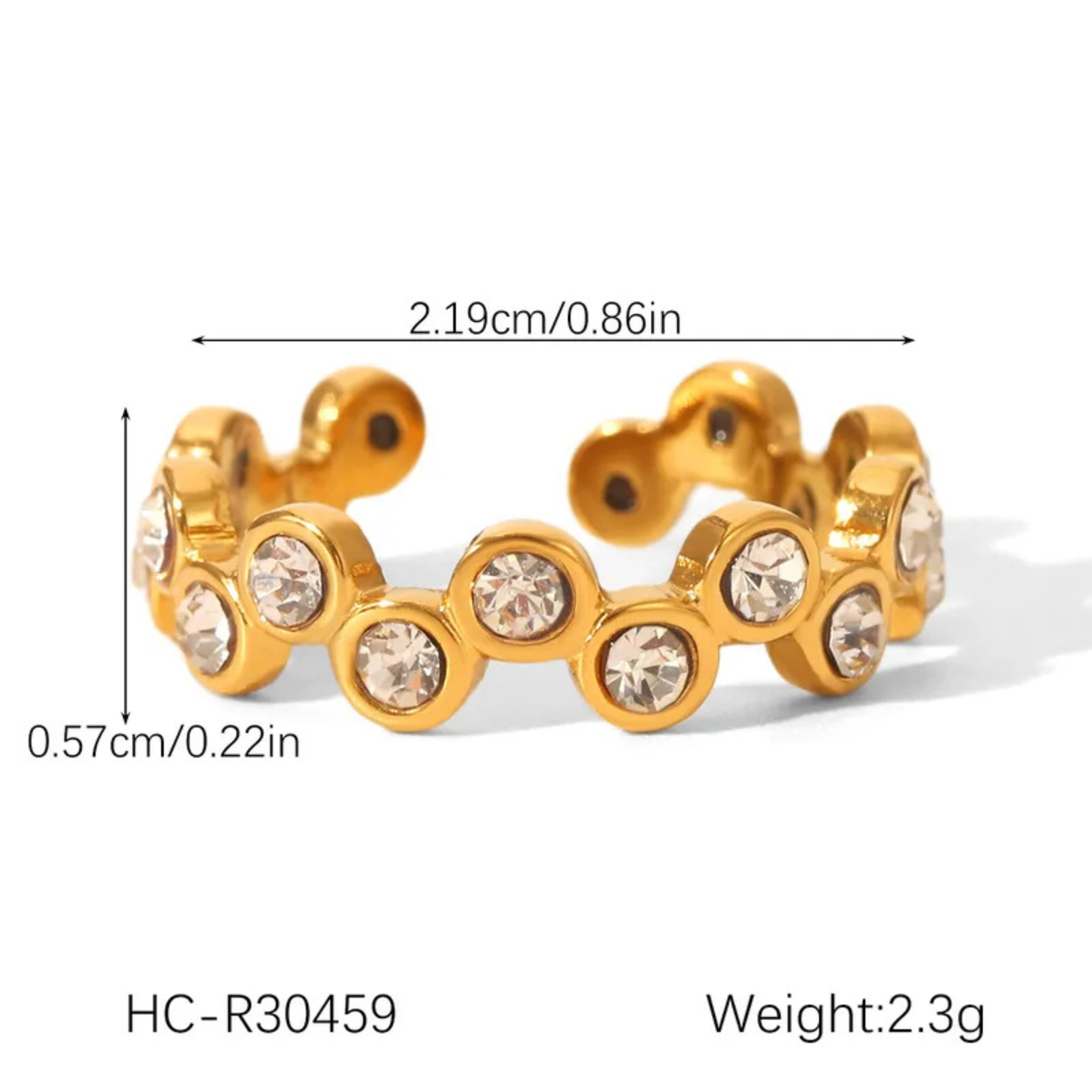 Gold-colored ring with embedded crystals and measurements on a white background