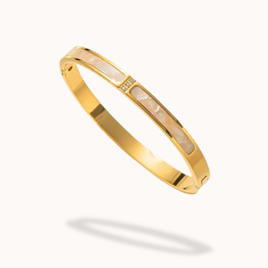 Gold bracelet on a white background