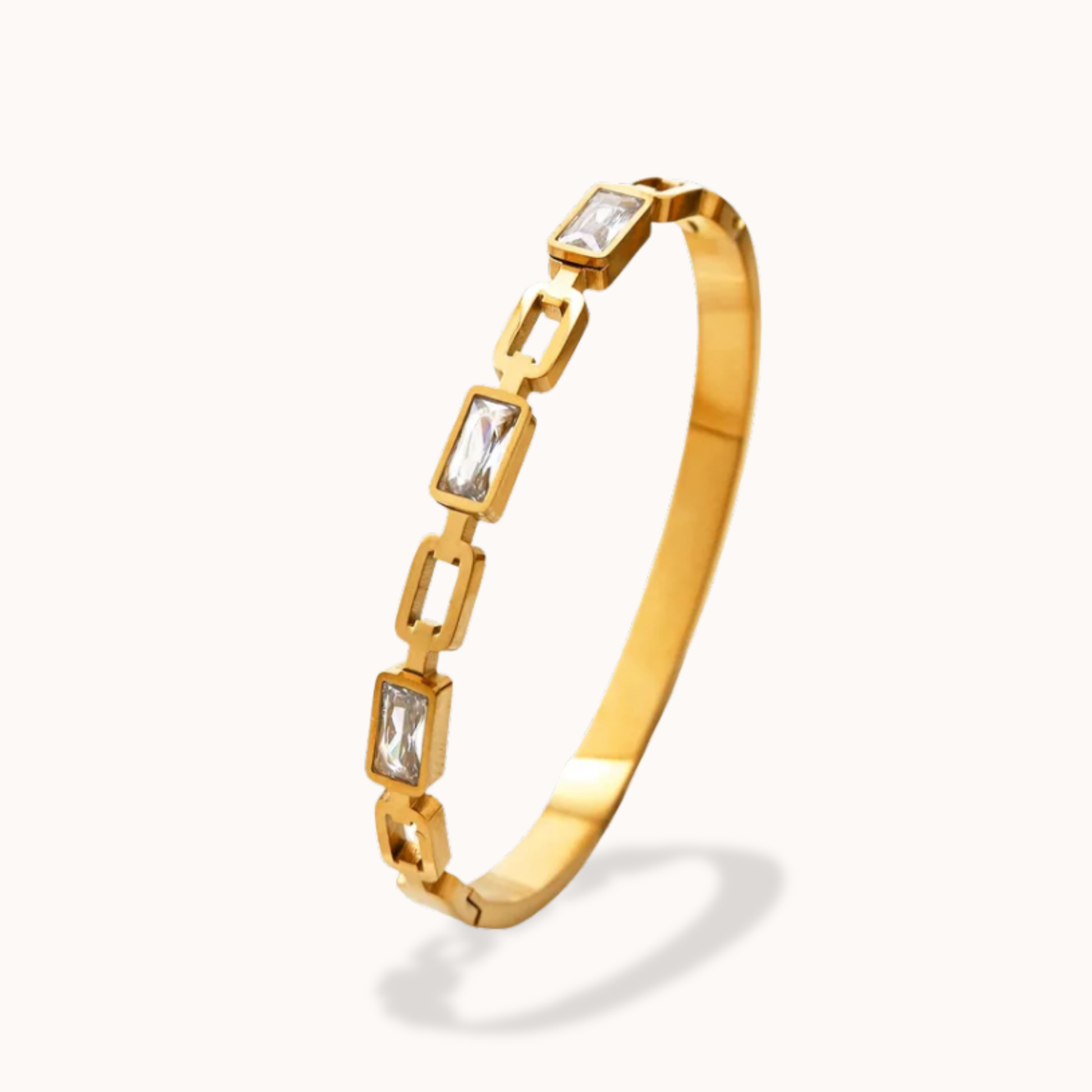 Gold bracelet with square gemstones on a white background