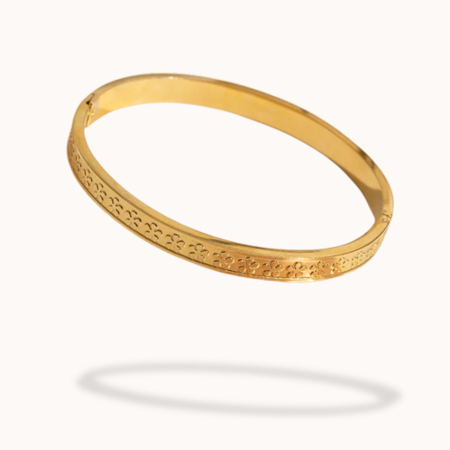 Gold bracelet on a white background