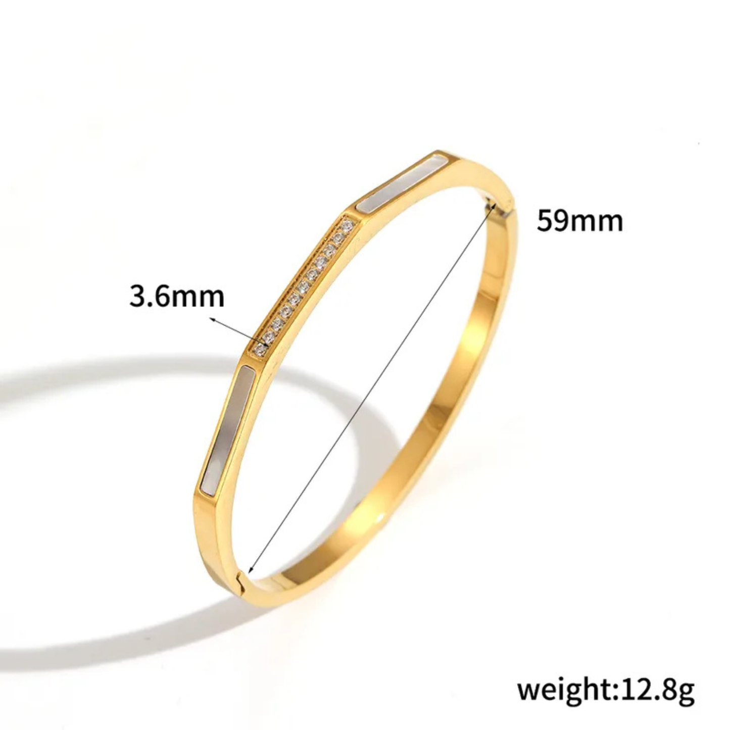 Gold bracelet with measurements on a white background