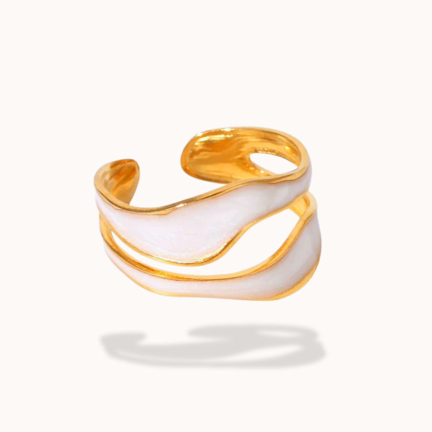 Gold and white ring on a white background
