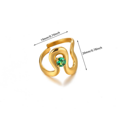 Gold ring with a green gemstone and measurements on a white background
