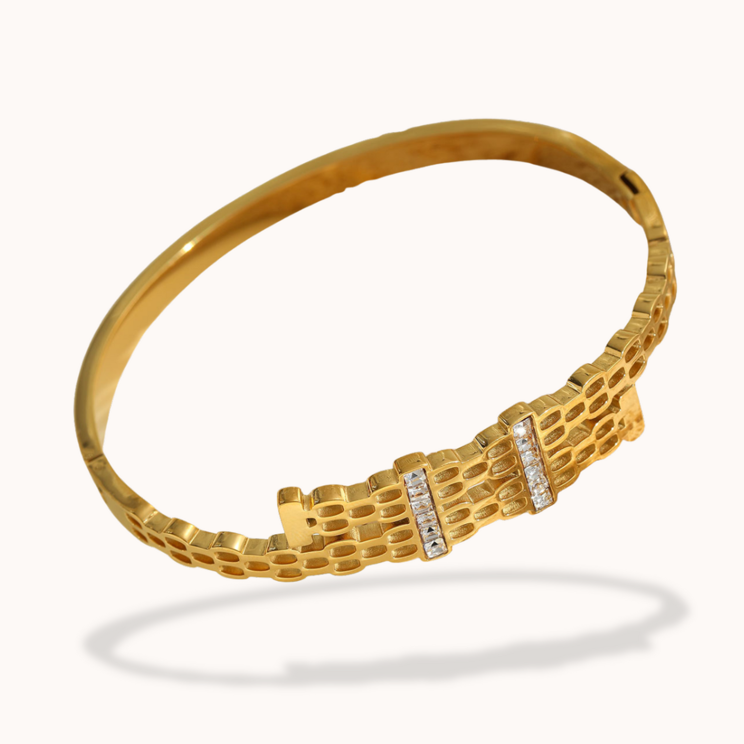 Gold bracelet with diamond accents on a white background