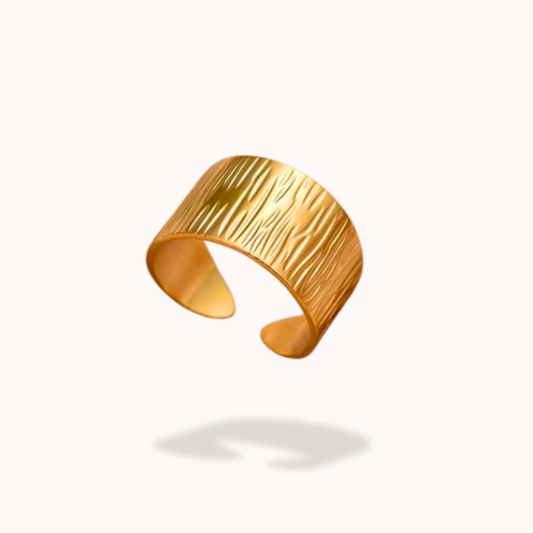 Gold ring on a white background