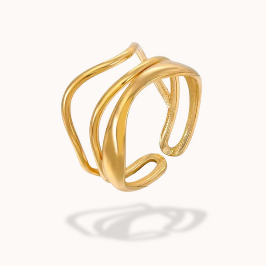 Gold open cuff ring on a white background