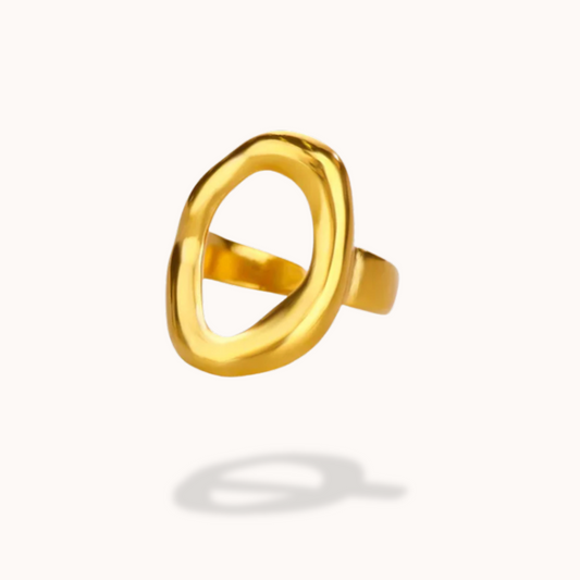 Gold ring with a unique design on a white background